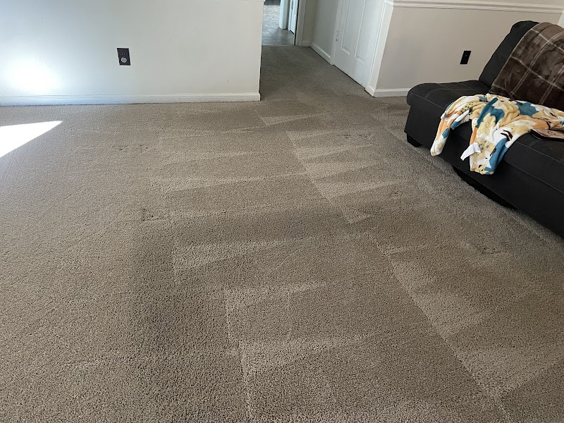 Kenja, owner of On The Spot Custom Cleaning, providing professional carpet cleaning service